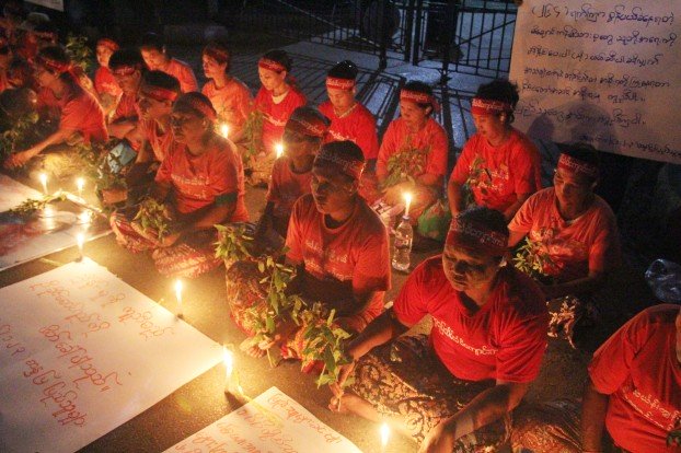Michaungkan protesters light candles in front of Rangoon City Hall
