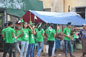 Locals decked out in USDP t-shirts support the rally in Myaungmya Township. (PHOTO: DVB)