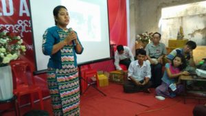 Phyu Phyu Thin speaks at the International AIDS Day event in the NLD headquarters in Bahan Township. (PHOTO: DVB)