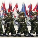 Soldiers carry their weapons as they march during the Armed Forces Day parade in Myanmar’s capital Naypyidaw