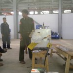 Officer from Thabeikkyin with Vacuum box in Factory 1