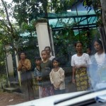 Relatives and neighbours of Thin Hla react as his body is taken away from his home outside Yangon