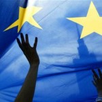 People wave a European Union flag