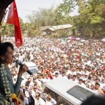 Myanmar opposition leader Aung San Suu Kyi talks to supporters at Yae Phyu village in Dawei township