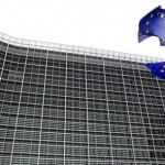 European Union flags are seen outside the European Commission headquarters in Brussels