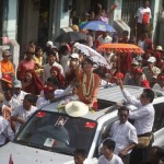 Myanmar pro-democracy leader Suu Kyi waves to supporters during her campaign trail in Pyapon township in Ayeyarwady Division