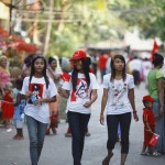 Women wear t-shirts printed with Myanmar’s independence hero General Aung San as they walk on a street during an election campaign of the National League for Democracy (NLD) party in Yangon