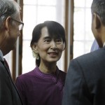 Myanmar pro-democracy leader Aung San Suu Kyi talks with guests during the opening ceremony of the European Union Office at Yangon