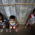 Ethnic Karen refugee children sit in Mae La refugee camp, outside Mae Sot district near the Thai-Myanmar border
