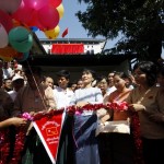 Myanmar’s pro-democracy leader Aung and NLD party leader Tin cut ribbon during ceremony to inaugurate their party’s new signboard at NLD’s head office in Yangon