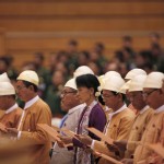 Myanmar pro-democracy leader Aung San Suu Kyi and members of parliament from the National League for Democracy take their oaths in the lower house of parliament in Naypyitaw