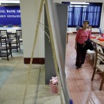 An employee walks inside a room used for daily foreign exchange auctions at Myanmar’s central bank in Yangon