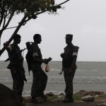 Members of the Border Guard of Bangladesh (BGB) stand guard by the Naf River, where Rohingyas from Myanmar commonly try to get into Bangladesh by boats, in Teknaf