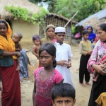 Rohingya refugees from Myanmar gather in an unregistered Rohingya refugee camp in Teknaf.