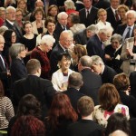 Myanmar pro-democracy leader Aung San Suu Kyi smiles as she leaves after addressing both Houses of Parliament in central London