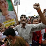 Refugees react as Suu Kyi arrives at the Mae La refugee camp near Mae Sot at the Thailand-Myanmar border