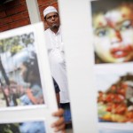 Muslims hold pictures and banners as they protest in front of Myanmar’s embassy in Bangkok