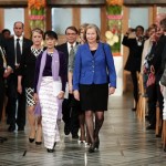 Myanmar opposition leader Aung San Suu Kyi and member of Nobel committee Kullmann Five arrive at a Nobel ceremony in Oslo City Hall