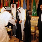 Saudi Arabia’s King Abdullah, Iran’s President Ahmadinejad and Qatari Emir Hamad are greeted by delegation at the opening ceremony of the OIC summit in Mecca