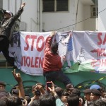 Muslim activists protest outside the Myanmar embassy in Jakarta