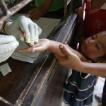 Children living in the Thai-Myanmar border come to a malaria clinic to get tested in Sai Yoke district