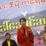 Myanmar pro-democracy leader Suu Kyi talks to supporters as she gives a speech in Monywa