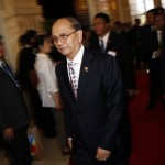Myanmar’s President Thein Sein leaves for a break during a plenary session on the second day of the ASEM summit in Vientiane