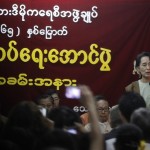Myanmar’s opposition leader Aung San Suu Kyi gives a speech on the event of Myanmar’s 65th Independence Day at the NLD head office in Yangon