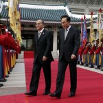 Myanmar’s President Thein Sein walks with South Korean President Lee during a welcoming ceremony at the presidential Blue House in Seoul