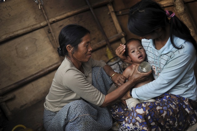 Rain dampens relief efforts as fighting continues in northern Burma