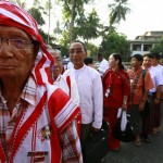 Congress delegates line up to register and attend the NLD party congress in Yangon