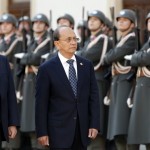 Austria’s President Fischer and Myanmar’s President Thein review the honour guard in Vienna