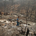 A refugee boy walks through the ruins of the Ban Mae Surin refugee camp near Mae Hong Son