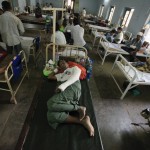 Patients who were injured in a recent riot are seen at a hospital in Meikhtila