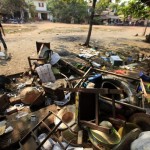 Destroyed furniture are seen in a market in Sitkwin