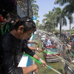 People play with water as they celebrate Thingyan in Yangon