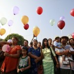 People wait for the opening ceremony of a water pavilion during a celebration for Thingyan in Yangon