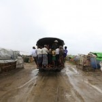 A vehicle carries people to a safer place from Cyclone Mahasen at a Rohingya internally displaced persons (IDP) camp outside of Sittwe