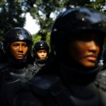 Indonesian policemen are deployed outside the embassy of Myanmar during a protest by Indonesian Muslim hardline groups in Jakarta