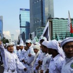 People from Indonesian Muslim hardline groups gather during a protest near the embassy of Myanmar in Jakarta
