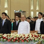 Myanmar’s President Thein Sein and Japan’s PM Abe stand at attention during the playing of national anthems in Naypyitaw
