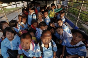 Children from Mon state ride to a school on Thailand's side of the border with Burma in Sangkhlaburi (Reuters)