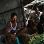 A Rohingya man sells betel leaves near internally displaced peoples (IDP) camps outside Sittwe