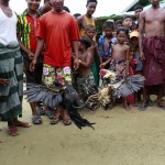 Rohingya Muslims watch a cockfight in Bawdupa IDP camp outside of Sittwe