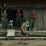 Soldiers stand guard at Aung Mingalar quarter in Sittwe