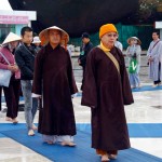 Buddhist pilgrims line up to pay respect at the holy site