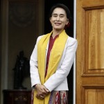 Myanmar’s opposition leader Suu Kyi smiles after her meeting with former Polish president Walesa in Warsaw