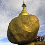 Buddhist devotees wait to offer gold to Kyaikhtiyo Pagoda, also known as Golden Rock Pagoda, in Mon State