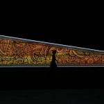 A performer walks during the opening ceremony of the 27th SEA Games in Naypyitaw