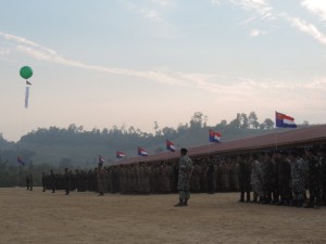 Soldiers from rival Karen armed groups stand together in unity to celebrate Karen New Year on 1 January 2014. (PHOTO: Portia Larlee)